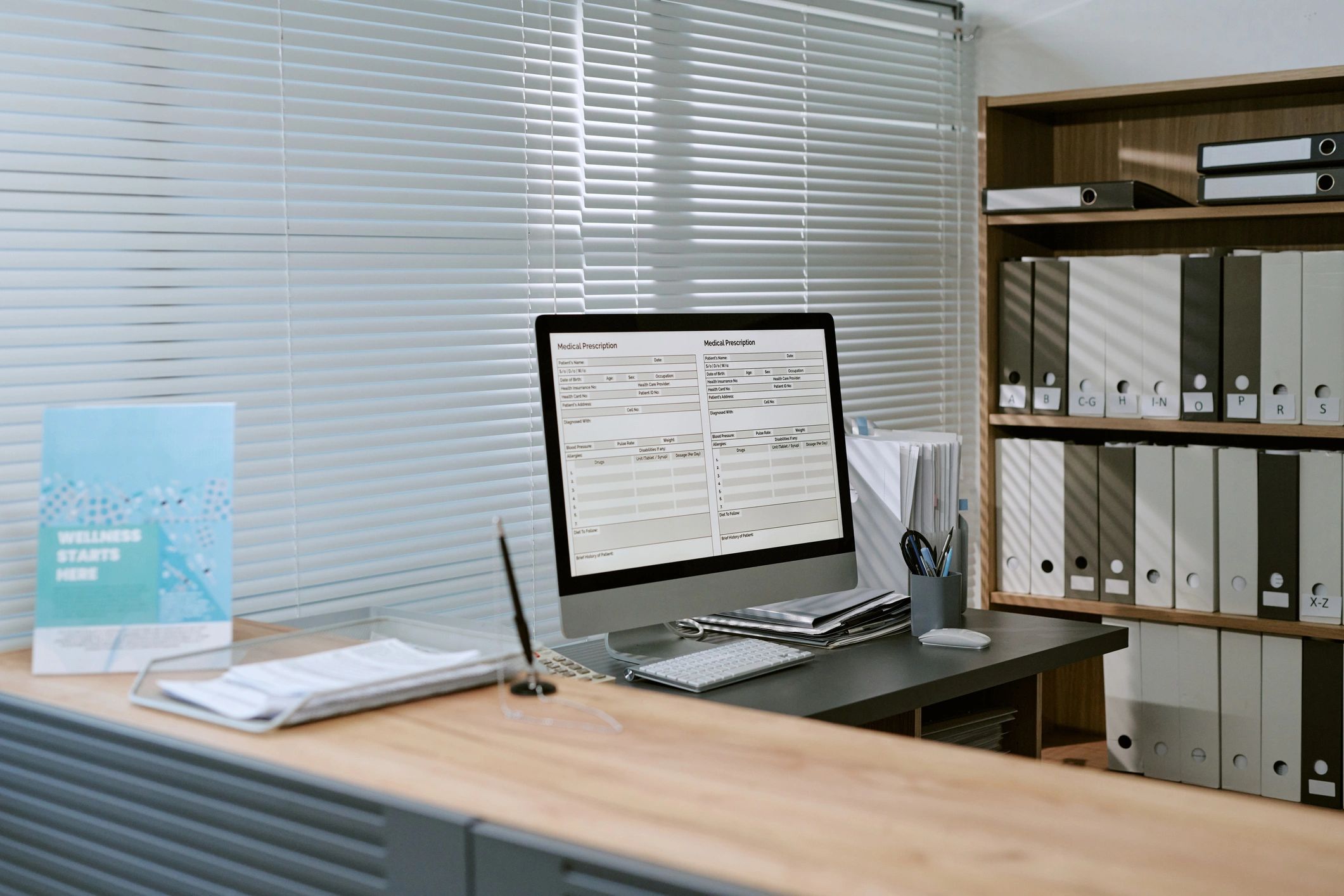 Desk monitor and records illustrating data access and privacy management